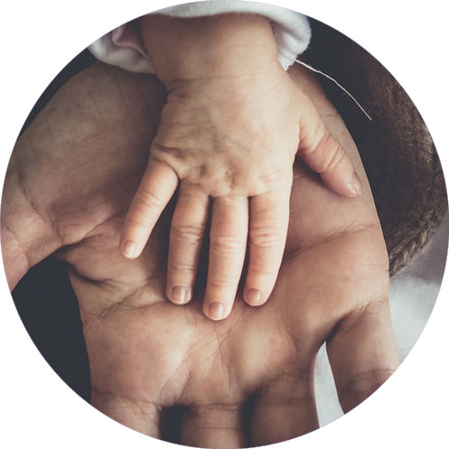 Adult's Hand under Child's Hand